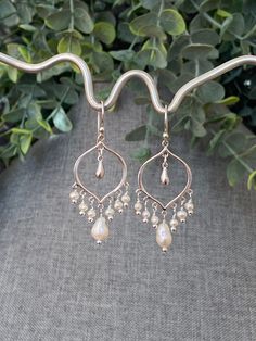 "20% OFF STOREWIDE!! MOTHER'S DAY is Sunday, MAY 14th!! Order now!  STUNNING Iridescent Freshwater Pearls and Sterling Silver Chandelier Earrings with Silver Sterling Teardrops and Sterling Silver Arabesque Ear Wires.  June birthstone: pearl Freshwater pearls are strong symbols of feminine energy. They are known to enhance personal integrity and support a sense of centeredness and calm.  DIMENSIONS: 2\" from the top of the ear wire 1 1/2\" from the bottom loop of the ear wire  ABOUT MY JEWELRY: Bohemian Drop Jewelry For Wedding, Artisan Teardrop Wedding Jewelry, Bohemian Silver Pearl Drop Jewelry, Bohemian Sterling Silver Pearl Drop Jewelry, Bohemian Sterling Silver Jewelry With Pearl Drop, Artisan Teardrop Jewelry For Anniversary, Bohemian Teardrop Pearl Jewelry, Delicate Teardrop Pearl Earrings Nickel Free, Delicate Teardrop Pearl Earrings Nickel-free