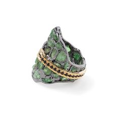 Celebrating the wonders of nature, this German Kabirski designer ring features raw tsavorite crystals and cut black spinel. Crafted from sterling silver and plated with black rhodium and 18K gold, it uses the innovative Stained Glass technique to highlight the untouched beauty of the raw tsavorite. The striking line of cut black spinel adds contrast and elegance. Perfect for those who feel a connection to Earth's ancient history and marvel at its artistry, this one-of-a-kind piece embodies authentic self-expression through modern jewelry design. Metal: 925 Silver Stones: Rough Tsavorite, Spinel Plating: Black Rhodium, 18K Gold  PLEASE NOTE: The raw gemstones have natural imperfections such as cracks and color spots, which are signs of authenticity. They may also appear differently under va Luxury Tsavorite Jewelry With Gemstone Accents, Tsavorite Jewelry With Gemstone Accents As Gift, Tsavorite May Birthstone Ring, Tsavorite Gemstone Jewelry For May Birthstone, Unique Multi-stone Emerald Jewelry, Luxury Tsavorite Ring Jewelry, Unique Green Tsavorite Ring, Unique Green Tsavorite Emerald Ring, Black Spinel Jewelry With Rose Cut Diamonds For Gift