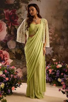 Sage green pre-draped saree with corset padded blouse. Comes with sequin, cutdana embellished cape. - Aza Fashions Green Pre-draped Saree For Wedding, Green Georgette Draped Saree, Green Pre-draped Saree With Sheer Dupatta For Evening, Green Pre-draped Saree For Reception, Green Draped Georgette Dress, Green Draped Saree For Wedding, Green Draped Saree With Unstitched Blouse, Green Draped Dupatta For Wedding, Elegant Green Draped Blouse Piece