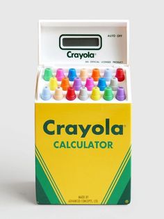 a box of crayola calculator sitting on top of a white table