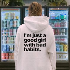 This stylish hoodie offers streetwear fashion with its words on the back detail and aesthetic look. Made of quality materials, it's sure to be a favorite with its trendy design and comfortable fit. Keep warm and stylish with the I'm Just A Good Girl With Bad Habits Hoodie. Hoodie Quotes Aesthetic, Trendy Hoodie Designs, Streetwear Hoodie Design, Girly Streetwear, Hoodie Design Ideas, Aesthetic Hoodies, Aesthetic Sweatshirt, Hoodie Quotes, Sweatshirt Streetwear