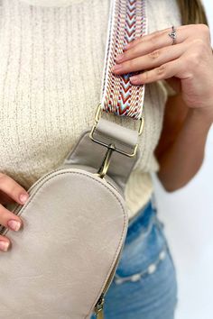 Super functional and oh-so-cute, the Sutton Sling Crossbody features multiple pockets to keep everything you need just a zipper away. The front compartment snaps closed and reveal three card slots when open—perfect for when you don't want to carry a full wallet. Silky smooth vegan leather and brushed gold hardware tie it all together. Details: 14.5” long x 6.5” wide x 2.5” deep The strap adjusts up to 47” long Trendy Chest Bag With Adjustable Strap For On-the-go, Trendy Crossbody Bag Strap With Cell Phone Pocket, Trendy Chest Bag With Pockets For On-the-go, Casual Beige Belt Bag With Detachable Strap, Casual Beige Bag Strap For Travel, Trendy Bag Strap With Zipper Closure For On-the-go, Beige Crossbody Chest Bag With Pockets, Adjustable Shoulder Bag With Zipper For On-the-go, Adjustable Zipper Closure Shoulder Bag For On-the-go