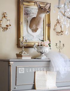 a dresser with a deer head on it