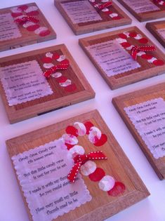 six wooden plaques with red and white hearts on them, each decorated with a poem