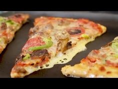 several slices of pizza sitting on top of a pan