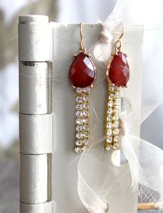 "These lovely earrings combine a pair of vintage clip on earrings (with the clip removed), that appear to be carnelian or a similar colored stone, with some rhinestone elements to create an elegant pair of earrings, suitable for an evening out or a special event. I enjoy collecting vintage and antique remnants and jewelry parts that could use some repurposing and/or upscaling. The length of these, minus the earwire, is 1 7/8\". I work with antique and vintage parts. Some may show signs of wear o Elegant Carnelian Dangle Earrings, Gold Carnelian Jewelry With Matching Earrings, Elegant Carnelian Drop Earrings, Elegant Gold Carnelian Earrings, Red Gemstone Accented Drop Earrings, Gold Carnelian Jewelry For Wedding, Red Dangle Jewelry With Gemstone Accents, Marble Necklace, Lucite Jewelry