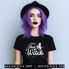 A Magical Black Witchy T-Shirt! Soft, light cotton, quality black t-shirt reads "100% That Witch". White printed design includes a witch on a broom with a cat. This comfy, contoured 100% cotton tee offers a semi-fitted silhouette and is pre-shrunk to ensure lastability. It features cap sleeves and a taped neck and shoulders. Perfect for yoga, pagan pride festivals, witchy beach days, or any time you want to feel like a Witchy Woman. 🖤 🌙 𝐓𝐡𝐢𝐬 𝐝𝐞𝐬𝐢𝐠𝐧 𝐚𝐥𝐬𝐨 𝐚𝐯𝐚𝐢𝐥𝐚𝐛𝐥𝐞 𝐨𝐧 𝐓 Black Witchy Tops With Letter Print, Cotton Short Sleeve Witchy T-shirt, Witchy Short Sleeve Cotton T-shirt, Witchy Cotton Short Sleeve T-shirt, Cotton Witchy Short Sleeve T-shirt, Witchy Short Sleeve Cotton Tops, Witchy Cotton Short Sleeve Tops, Black Slogan T-shirt For Halloween, Halloween Cotton Top With Slogan