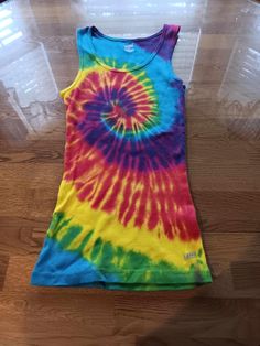 100% cotton. Slim fit. Machine or hand wash cold, with like colors. No chlorine bleach. Air or tumble dry low. Rainbow Tie, Tank Tops Women, Womens Clothing Tops, Tie Dye, Art Collection, Slim Fit, Rainbow, Tank Tops, Bathing Beauties