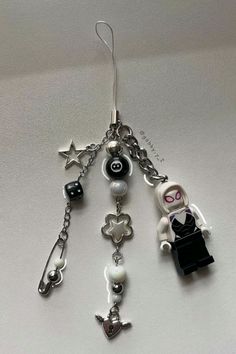 the key chain has charms attached to it