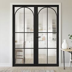 an open glass door in a white room