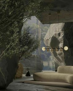 a living room filled with lots of furniture next to a large rock wall covered in greenery