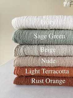 towels stacked on top of each other with the words sage green beige nude light terracotta rust orange