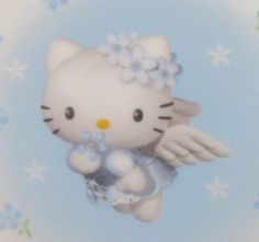 a hello kitty figurine is flying in the sky with flowers on it's tail