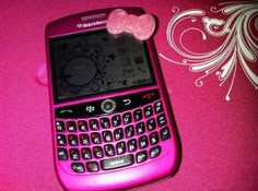 a pink cell phone with a heart on it