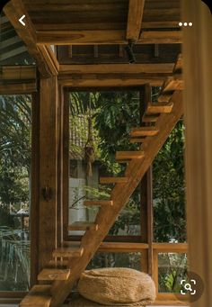 a wooden staircase leading up to the second floor