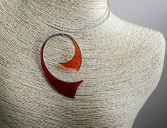 Red orange jewelry set. Art necklace and earrings set made of stainless steel, red and orange epoxy resin. ABOUT ME My name is Nikolin Georgiev and I live in Sofia, Bulgaria. I love creating beauty therefore I make jewelry. I love colours and stones' emanation. I also love the soft warmth of wood as well as the glitter of the buffalo horn. I like natural materials and I enjoy combining them. I use whatever Mother Nature had given us and let the material lead me until I reach the completeness of Modern Resin Jewelry For Gifts, Modern Resin Jewelry Gift, Unique Red Round Pendant Jewelry, Modern Red Necklace For Gift, Unique Orange Nickel-free Jewelry, Modern Red Necklace Perfect As A Gift, Nickel-free Red Resin Jewelry, Modern Orange Necklace As Gift, Modern Orange Necklace For Gift