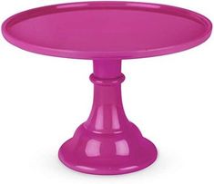 a pink cake plate on a white background