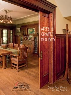 an open door leading to a dining room with wooden furniture and chandelier hanging from the ceiling