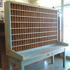 an old wooden bench sitting in the middle of a room