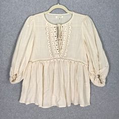 Max Studio Top Womens Xs Cream Blouse Crochet Cottage Fairy Cowgirl Coastal Tie Beach Vacation Resort Coastal Western Cowgirl Rodeo 3/4 Sleeve Balloon Puff Peplum Pleated Flowy $98 Msrp New With Tag Sku 4558 **Please See All Pictures For Full Item Condition, Details, And Approximate Measurements** - Ships Same/Next Day, Professional Seller, Offers Welcome, Like Or Watch For Price Drops - Item In Photos Is Exact Item You Will Receive - I List New Items Daily, Be Sure To Browse My Store/Closet For Summer Peasant Top With 3/4 Sleeves, Peasant Style 3/4 Sleeve Summer Top, Peasant Style 3/4 Sleeve Top For Summer, Cream Peasant Top With Lace Trim For Summer, Spring Fitted Beige Peasant Top, Fitted Cream Peasant Top For Spring, Beige Long Sleeve Lace Top For Summer, Spring Long Sleeve Blouse With Crochet Trim, Fitted Spring Blouse With Crochet Trim