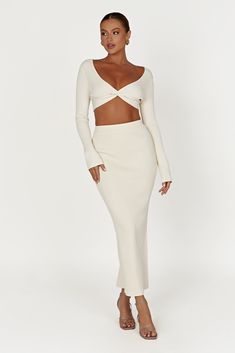 Going out, staying in, or simply keeping it casual, KAESHA fits in everywhere. She’s the perfect crop that mixes eye-catching style with smooth-wearing comfort. Featuring a deep V neckline and elongated full-length sleeves, she’s all about keeping the message simple but saying a lot with a little. Dress her up with our Kaesha Split Midi Knitted Skirt or pair her with MESHKI Denim for a relaxed look. FEATURES: Deep V neckline Centre front twist detail Full length sleeves Cropped fit FIT, FABRIC & Long Lunch, Chic Desk, Knitted Skirt, Oversized Blazer, Orange Dress, Twist Front, Staying In, Summer Maxi Dress, Knit Skirt