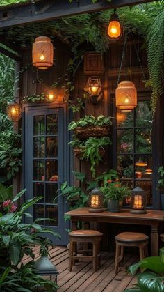 an outdoor dining area with plants and lights