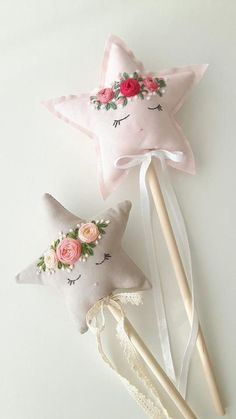 two pink stars with flowers on them next to toothbrushes