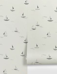 two wallpapers with sailboats on them, one in grey and the other in white