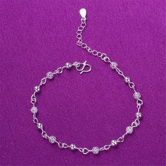 Show off your pedicure and add touch of light-catching shine to your ensemble with this elegant anklet plated in gleaming silver. 0.27" H x 9.84" L S-hook clasp Silver-plated copper Elegant Anklet, Anklet For Women, Women Anklets, Sterling Silver Anklet, S Hook, Silver Anklets, Chain Anklet, Charm Bangle, Anklet Jewelry