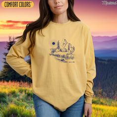 Discover the perfect blend of style and comfort with our "Take a Hike" Mountain Scene Camping Shirt, designed specifically for hiking lovers. This trendy long sleeve t-shirt features a beautiful pine tree graphic, ideal for anyone who appreciates the great outdoors. Whether you're hitting the trails or relaxing at camp, this unisex aesthetic shirt is a thoughtful gift for hikers and adventurers. Made with high-quality materials, it's not just a mountain shirt but also a vintage hiking shirt that stands out in your wardrobe. Perfect for both men and women, this hiking lover shirt ensures you express your passion for nature while staying cozy and fashionable. Embrace your adventurous spirit and proudly wear your love for hiking with this stylish camping shirt! *View ALL Comfort Colors Long S Hike Mountain, Unisex Aesthetic, Vintage Hiking, Camp Shirts, Aesthetic Gift, Adventure Hiking, Mountain Shirt, Hiking Shirt, Aesthetic Shirt