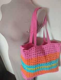 Crocheted handmade cheerful bag. In fuchsia pink, turquoise orange and yellow. Mesh lining and handles and magnetic closure. Measurements: width 36 cm, height 30 cm. Lovely colorful bag handmade in crochet. In fuschia pink, orange, turquoise and yellow. Mesh lining and a magnetic closure. Measurements: width 36 cm, height 30 cm. Beach School, Crochet Shoulder Bag, Orange Turquoise, Fuschia Pink, Colorful Bags, Orange And Turquoise, Pink Turquoise, Bag Handmade, Fuchsia Pink