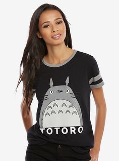 a woman wearing a black tshirt with totoro printed on the front