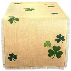 a table runner with four leaf clovers on it