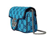 This sophisticated handbag from Gucci is crafted with a luxurious quilted canvas. The bag is adorned with an antique silver-tone GG logo on the front and the iconic GG pattern. The chain strap, which can be worn as a double chain shoulder strap or as a crossbody, and the interior zipper pocket add functionality, while the combination of the shades of blue add a cohesive yet unique touch.     Model: 443497  Blue GG Canvas pattern  Silver-Tone Hardware  GG Logo on Front  Push Lock Closure    Navy Gucci Bags With Logo Hardware For Evening, Trendy Gucci Rectangular Bag, Trendy Rectangular Gucci Bag, Gucci Rectangular Shoulder Bag, Rectangular Gucci Bag With Logo Hardware, Gucci Rectangular Bag With Logo Hardware, Designer Silver Gucci Bags, Gucci Bag With Metal Logo For Everyday Use, Formal Silver Gucci Shoulder Bag