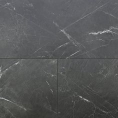 black marble tiles with white lines on them