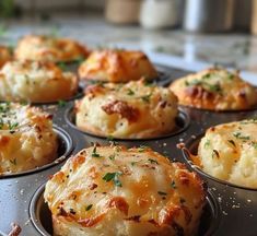 a muffin tin filled with lots of different types of bread and cheese toppings