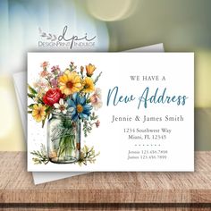 a new address card with flowers in a mason jar