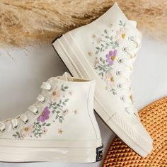 '' Wedding Converse for Bride, Bridal Flower Embroidered Sneakers Custom, Converse Embroidery Floral, Flower Embroidered Converse, Hand Embroidered Shoes, Wedding Gift '' 🍀 Price includes Converse Shoes and Floral Embroidery Designs as shown 🍀 🍀 Shoe Type: Converse 1970s 🍀 Shoe color: 2. Invory_1970s 1. DETAILS 🍀 You can send me your Converse, Vans, canvas shoes or I can buy them for you. Custom-ordered embroidered Vans and Converse shoes, please wait another 2-4 days. Each pair is hand embroidered to order, please make sure you put in the correct shoe size before you check out. The embroidery is meticulous and does not fade. 🍀 You will receive Vans and Converse shoes with floral embroidery designs as above. 2. PERSONAL EXPRESSION 🍀 Create your unique vibe by your own design of embr Embroidered Vans, Cute Converse Shoes, Boho Wedding Gifts, Bridal Sneakers, Embroidered Converse, Cute Converse, Wedding Converse, Wedding Sneakers, Custom Converse