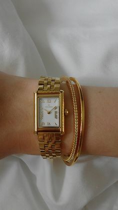 Golden Watch With Bracelet, Golden Watch Aesthetic, Gold Watches Women Aesthetic, Gold Watch And Bracelet Stack, Gold Watch Stack, Bracelet Stack Ideas Gold, Gold Watch Aesthetic, Watch And Bracelet Stack, Golden Watch Women