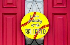 a red door with a yellow sign that says we are probably at the ballfield