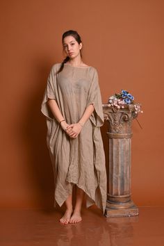 "High Low Linen Tunic in Many Colors - Long Sleeves Top with Pockets in Asymmetric Style Beautiful long linen tunic. Suitable for the beach, suitable for your sunny holidays.  Suitable for city life, but it is nice to combine it with long linen trousers.  This tunic radiates style. It is made of very soft natural linen. ☘ The style I used was originally designed and professionally constructed by me. Each item of my shop has a special package.  Handmade in a pet-free and smoke- free environment. Model is wearing size S Material: Linen 100% Color: Natural Beige Model wearring size S heigth 175 cm. - 5\"9 inches EXPRESS SHIPPING  Every piece is made to order, turnaround time is 2-5 days. ★ Please CAREFULLY read the size chart (inches) below to decide which size fits you well, returning an ite Oversized Bohemian Linen Dress For Spring, Spring Vacation Lagenlook Linen Dress, Flowy Lagenlook Beach Dress, Flowy Lagenlook Dress For The Beach, Lagenlook Short Sleeve Linen Beach Dress, Beach Lagenlook Dresses For Spring, Beige Lagenlook Dress For Summer, Bohemian Oversized Linen Dress For Beach, Oversized Bohemian Linen Beach Dress