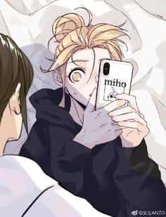 a man laying in bed while looking at his cell phone with the word mimo on it