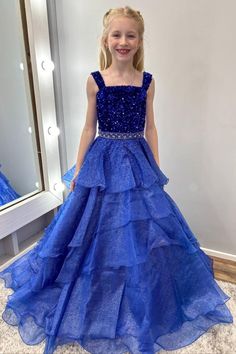 "Dazzle on stage with this Royal Blue Sequin Beaded Multi-Layer Ruffle Girl Pageant Gown! Featuring a eye-catching sequined top and beaded, multi-layered ruffle skirt, this long gown is perfect for pageants. With delicate straps for comfort and a stunning design, this gown will make any girl feel like a winner!"#wedding#flowergirldresses#girlpartydresses#girlbirthdaydresses#girlpageantdress Tulle Pageant Dress With Ruffles For Prom, Tulle Pageant Dress With Ruffles For Prom Season, Ruffled Ball Gown Pageant Dress, Tulle Ruffle Pageant Dress For Prom Season, Ruffled Ball Gown For Debutante Ball, Ruffled Ball Gown For Debutante Ball Pageant, Floor-length Gown With Ruffles For Pageant, Blue Sequin Gown For Quinceanera, Blue Sequin Quinceanera Gown