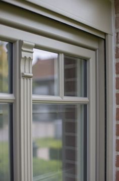 an open window on the side of a brick building