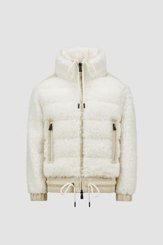 Crafted from plush teddy fleece, this cardigan adds warmth and texture to a winter wardrobe. The warmer is enriched with a trim in nylon laqué, a signature Moncler fabric notable for its glossy texture and water-repellent protection. A warm-filled front and collar complete the design. Designer Beige Winter Cardigan, Designer White Winter Cardigan, Luxury White Winter Cardigan, Winter White Shearling Outerwear, White Shearling Outerwear For Winter, Designer Cream Outerwear For Winter, Moncler Grenoble, Personalized Jacket, Luxury Outerwear