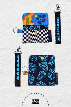 three different wallets with key chains attached to them