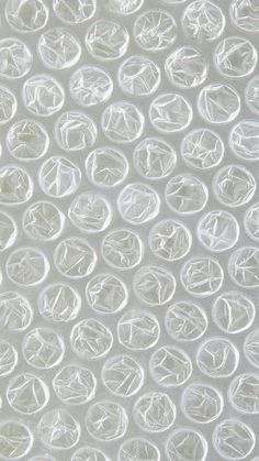 a close up view of the white plastic material that looks like circles on a sheet of paper