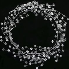 PRICES MAY VARY. PACK OF 4 STRINGS: Each Diamond Ice Wire Clear Plastic Branch Garland measures approximately 5 feet (1.5m) long, 20 foot (6m) in total. Branch Length: 5ft /150cm, Stem Length: 5" /12.5cm, Each branch has 45 stems, each Stem has 4 shining diamond ice beads, and one branch has 180 transparent diamond ice beads in total. CLEAR ACRYLIC PLASTIC PREMIUM QUALITY: Made of plastic and steel metal wire, flexible wire stems and bendable wire branch, lightweight, very sturdy durable and reu Winter Wonderland Home Decor, Branch Garland, Garland Christmas Tree, Winter Wonderland Decorations, Crystal Garland, Ornament Garland, Crystal Christmas Tree, Christmas Diamonds, Diamond Ice