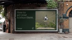 there is a sign that says here to get your science there on the side of a building