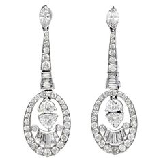 Elegance and movement on these Dangle Drop Earrings! These 1990's pieces are centered by 4 Trillion-cut Genuine diamonds, the top is adorned by 2 Marquise-cut Genuine diamonds and 16 baguette-cut  Prong Set and Chanel set, weighing 3.00 carats in total (G-H color, VS clarity, Surrounding the piece there are (56) round diamonds,  totaling 1.70  carats, with (G-H  color, VS clarity) Excellent for a gift and for Holidays Wear!  Match this piece with Bracelet #1029703 & Necklace #1029701  Weight: 9. Chanel Set, Royal Jewels, Gold Collection, Girly Jewelry, Gorgeous Jewelry, Diamond White, Ear Piercings, Round Diamonds, Diamond Jewelry